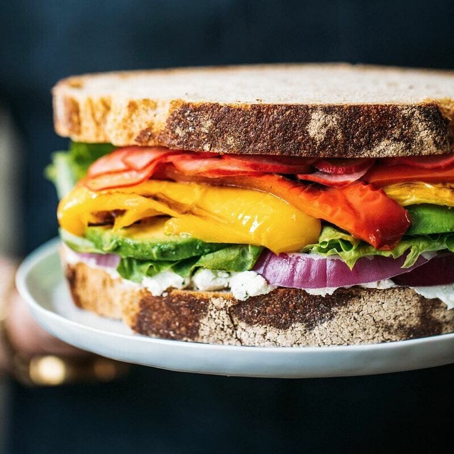 Colorful vegan sandwich filled with fresh vegetables